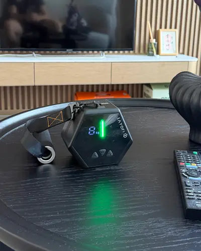 Go-Tone Pro on a living room coffee table next to a TV remote